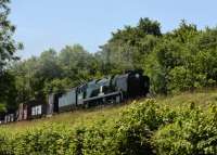 34053 <I>Sir Keith Park</I>, a rebuilt Battle of Britain 4-6-2, working a demonstration freight train at the Mid-Hants End of Southern Steam 50th Anniversary Gala. Seen between Medstead and Ropley on 2nd July 2017<br>
<br>
<br><br>[Peter Todd 02/07/2017]