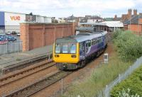 142018 squeals on the sharp curve as it leaves Hartlepool with a Nunthorpe to Newcastle service on 24th June 2017. On the left is the freight only Up Line and disused platform.  <br><br>[Mark Bartlett 24/06/2017]