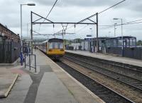 Looking east along the <I>Sheffield</I> platform at Guide Bridge as a Rose Hill bound Pacer pulls in on 16th June 2017. This station once had four tracks and platforms but the new ticket office and car park now occupies the old trackbed behind the Manchester platform. [See image 41751] of this station in 1981. <br><br>[Mark Bartlett 16/06/2017]