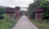 View west across the Logierait Viaduct in 1990, before restoration (a few years after this photograph there was doubt about the future of the bridge, due to its condition).<br><br>[Ewan Crawford //1990]