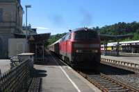 The photographer got rather over-excited when he heard the roar of a Class 218 diesel hydraulic at Sigmaringen on 11th June. The 218s were the backbone of DB's main-line diesel locomotive traction from the 1970s up to the reunification of Germany, but conversion of services to DMU operation and electrification have severely depleted their passenger operations. A pocket of 218-hauled services survives in this part of Germany, centred on Ulm. The service being hauled here is a Sundays Stuttgart-Aulendorf IRE train, with a van for bikes.<br><br>[David Spaven 11/06/2017]