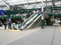 Another bonus resulting from the platform 12 extension work at Waverley will be the relocation of the escalator linking the western concourse and the cross-station walkway alongside platform 11. Installed at the end of 2013, its position has always irked me in the same way as a crooked picture frame [see image 50992]. The changes will see the escalator repositioned parallel with the walkway [see new station layout diagram]. The offending structure is seen here on 13 July 2017 looking east along platform 11.<br><br>[John Furnevel 13/07/2017]