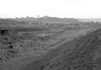 Looking west from Ponfeigh in 1986. Douglas Colliery, closed in 1967, is in the background. The washery can be seen. The colliery was served by a branch, the junction for this was just east of the station.<br><br>[Bill Roberton //1986]