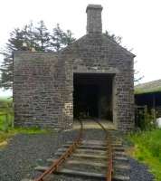 Both the hole in the wall, and the track leading into it, are definitely not original features of these railwaymen's cottages at Saughtree. [see image 53975]<br><br>[Ken Strachan 10/07/2015]