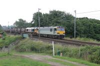 Interesting motive power on the NACCO Tanks from Willesden to Irvine on 19th July 2017. GBRf 92044, the former <I>Couperin</I>, was the train engine but behind it, dead in train, was GBRf 66765. The long train of bogie tank wagons is seen heading through Bay Horse.<br><br>[Mark Bartlett 19/07/2017]