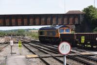 GBRf 66735 heading an empty ballast train through Westbury in the direction of Bath on 18th July 2017.<br><br>[Peter Todd 18/07/2017]