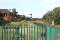 The approach to Llandudno in July 2017. The semaphore signal, with its calling on arm and platform indicator, controls access to the station. Alongside is a stabling siding with run round loop that still apparently sees occasional use. [Ref query 1661]  <br><br>[Mark Bartlett 26/07/2017]