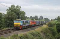 Colourful 90024, and DBS Red 90019, double head a Mossend to Daventry liner train towards Bay Horse on 19th July 2017. <br><br>[Mark Bartlett 19/07/2017]