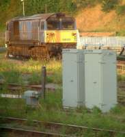 A neglected looking 58005, in Midland Mainline livery, standing in the sunshine at the end of a siding behind Leicester TMD on 16 August 2002. Built at Doncaster Works in 1983, the locomotive was named <I>Ironbridge Power Station</I> in 1986. Following withdrawal it was stored for a lengthy period before being sold on. It was subsequently exported to France together with several classmates.<br><br>[Ian Dinmore 16/08/2002]