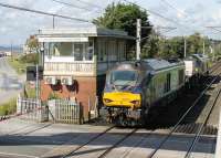 Having just left the chord from Bare Lane, 68029 and 68022 accelerate past the closed box at Hest Bank and return to Sellafield with a single wagon load from Heysham Power Station. 20th July 2017. <br><br>[Mark Bartlett 20/07/2017]