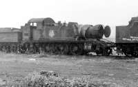 Looking rather as though the safety valves stuck on its last run, GWR 2-6-2T 5526 stands in one of the scrap lines at Barry in October 1975. As with most of the other occupants its was eventually rescued and has since been transformed into a push-pull fitted tank engine working on the Dart Valley line. [See image 34313]<br><br>[Mark Bartlett 28/10/1975]