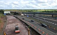 Not quite yet matching up to the artist's impression [see image 46140], the view across the M8 from the replacement Bredisholm Road bridge currently features the renovation work on the old A8 Cutty Sark bridge.<br><br>[Colin McDonald 26/07/2017]