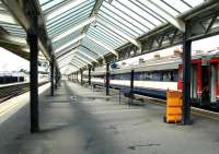 Looking out from the station concourse at Weymouth in May 2002 along platforms 2 and 3. The train at platform 3 is being prepared to form the next scheduled service to Waterloo.<br><br>[Ian Dinmore 03/05/2002]