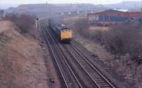 Whifflet North Jct, viewed from close to Rosehall Junction, in 1980 with a Class 25 on  lightly loaded train of 16T mineral wagons. R.B.Tennants was still in full production at this time with Meadow Works top right corner.<br>
<br><br>[Alastair McLellan //1980]