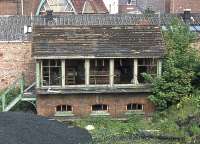 Before the Norwich Victoria coal depot was closed in the 1980s and the site given over to a supermarket, this derelict signal box was to be found alongside the coal near the Southwell Road bridge. Its last use was probably in the 1960s when the Norwich Victoria General Goods Depot was in operation. This was the state of decay on 29th May 1976.<br><br>[Mark Dufton 29/05/1976]