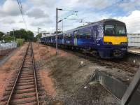 ScotRail 320411 rests in bay platform 1 at Airdrie on 2 August 2017, after treating me to my first 'station skipping' experience. It left on time on its return journey, depositing several bemused 'scenic route' passengers at various stations on the way back west.<br><br>[Colin McDonald 02/08/2017]