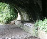 Remains of the goods platform at Colinton in July 2017, looking west below the B701 road bridge towards Balerno. [See image 56932]<br><br>[John Furnevel 27/07/2017]