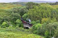 The northbound afternoon <i>Jacobite</i> hauled by Black 5,No.45212,with the nameboard carried on its distinctive offset lamp iron,exits Borrodale Tunnel and is immediately onto the viaduct, followed by a climb of 1 in 60 towards Arisaig.<br><br>[John Gray 02/08/2017]