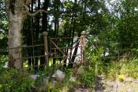 It comes to something when a gate is all that remains of a station. Still, that's more than some. This gate was on the west side of Lugton High, with a railwayman's cottage beyond, in use as a house.<br><br>[Ewan Crawford 03/08/2017]