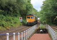 66733 <I>Cambridge PSB</I> enters Garelochhead station with the aluminium tanks from North Blyth to Fort William on the afternoon of 29th July 2017. <br><br>[Mark Bartlett 29/07/2017]