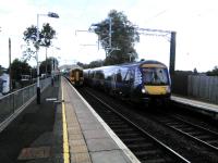 Glasgow (right) and Dunblane services cross at Bishopbriggs on 5 August.<br><br>[David Panton 05/08/2017]