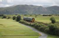 ATW 158818, on a short working from the junction to Llandudno, runs by a local golf course with the Conwy Estuary in the background on 26th July 2017.<br><br>[Mark Bartlett 26/07/2017]