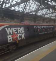 An enormous mobile Virgin Radio advert seen at Glasgow Central.<br><br>[John Yellowlees 02/08/2017]