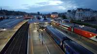 First light on a damp morning at Stirling and the red and grey livery of the 0526 VTEC service to Kings Cross contrasts with the blue of the Scotrail Sprinter in the bay platform. 7th August 2017.<br>
<br><br>[David Prescott 07/08/2017]