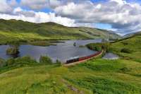 Under an angry looking sky,Black 5 No.45212 hauls the afternoon <b>Jacobite</i><br>
round the edge of,breeze ruffled, Loch Eilt on the way to Mallaig.<br><br>[John Gray 05/08/2017]