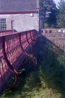 A view of the bridge which linked Gleneagles station to the ticket office (now a house), note the blocked up access at the far end. The bridge spanned the tracks of the Crieff platform and goods lines. The bridge has since been removed and the new road access from the A823 partly follows the trackbed.<br><br>[Ewan Crawford //1989]