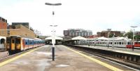 General view south along the main line platforms at Wimbledon in July 2004, with the LU District line to the right and the South London Tramlink platform on the extreme left at the far end of the station. [See image 5322]<br><br>[John Furnevel 03/07/2004]