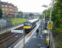 A Cumbernauld to Dumbarton Central calls at Duke Street during one of the day's frequent showers.<br><br>[David Panton 05/08/2017]