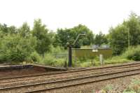 A steam era water column on the west bound line at Haltwhistle.<br><br>[Peter Todd 24/07/2017]