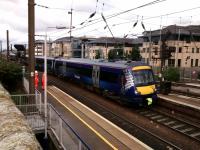 170472, on a Glasgow Queen Street to Edinbrgh Waverley service, clatters over the points at Haymarket East and into the station. Photographed from Distillery Lane on 7 August 2017.<br>
<br><br>[David Panton 07/08/2017]