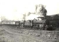 The 10.21 am West Highland train climbing Cowlairs Bank shortly after leaving Queen Street on 3 August 1957. Black 5 44908 is piloting K2 61785.<br><br>[G H Robin collection by courtesy of the Mitchell Library, Glasgow 03/08/1957]