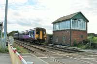 Northern 156424 heads towards Newcastle passing Brampton Fell level crossing with a service on 4th August 2017. When the Newcastle and Carlisle Railway opened in 1836 there was a station here but it closed just two years later (almost 180 years ago!). [See image 39368] showing the old style barriers previously in use at this crossing. <br><br>[Mark Bartlett 04/08/2017]