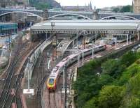 The east end of Waverley on a Sunday morning in September 2006 with work in progress in several areas, including the new north side Balmoral through platform.  A Virgin Voyager is leaving platform 1/19 on a CrossCountry service to Plymouth, while stabled class 67 and 90 sleeper locomotives and a class 322 EMU occupy bay platforms.<br><br>[John Furnevel 10/09/2006]