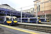 An impressive line up of turbostars at Glasgow Queen Street on 31st July 2017. It was not good news though as ten turbostar units idle in the station at 10.00 on a Monday morning meant something was not quite right. In this case, there was 'severe' disruption of the Glasgow- Edinburgh services thanks to a points failure.<br><br>[Mark Dufton 31/07/2017]