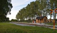 The station building now at Roma was originally that from Österport Halt in Visby. It had been a hunter's forest shelter for decades before being moved, restored and then re-opened in 2015. Roma village had been a hub for two of Gotland's railways and originally had a much bigger station building.<br>
The runround loop extends to a headshunt over a level crossing off to the right of picture. There is a bay platform whose buffer stop is visible to the left of the platform bench. There are plans to rebuild the turntable on its original site and build a new water tower in the grey area on the left centre of the shot.<br><br>[Charlie Niven 06/07/2017]