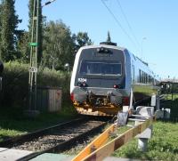 A Norwegian Class 92 DMU leaves Östersund's second out of three stations. The joint operation of the route to and from Trondheim between NSB and Veolia, known as Mittnabotåget, finished in 2012. For a view of a similar unit in Trondheim [see image 60418]<br><br>[Charlie Niven 16/08/2010]