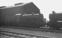 Steam in the shadows, on shed at Thornton Junction in the summer of 1966. Class J38 0-6-0 no 65931 is standing on the left. The locomotive was withdrawn from Dunfermline shed in September of that year and cut up at Shipbreaking Industries, Faslane, the following January.<br><br>[K A Gray //1966]