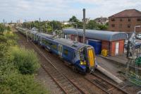 380108 leaves Ardrossan South Beach. The lesser used line to the left is dedicated to freight from Hunterston. Perhaps one day to become passenger again.<br><br>[Ewan Crawford 10/08/2017]