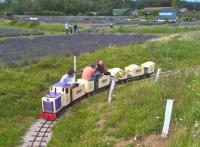 The 7.25 inch gauge WWLR was built in 2005, allegedly to bring the lavender in from the fields to the distillery (right background - no drams, I'm afraid) There is a businesslike petrol driven engine and freight wagons, but the layout leads me to suspect that passenger traffic was always intended. Wintringham is near Malton.<br><br>[Ken Strachan 06/08/2017]