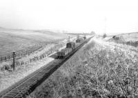 The Greenlaw branch pickup goods near Fans Loanend siding on the eastern outskirts of Earlston in 1965. The locomotive is propelling wagons for the sawmill at Earlston. [See image 22900]<br><br>[Bruce McCartney //1965]