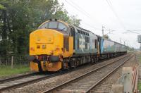 Large-logo 37402 propels 2C32, the 05.15 Carlisle to Preston service, past the level crossing at Bolton-le-Sands on 11th August 2017. There have been a number of failures on the Cumbrian Coast loco hauled services but this train was <I>Right Time</I> as it passed heading towards Lancaster.   <br><br>[Mark Bartlett 11/08/2017]