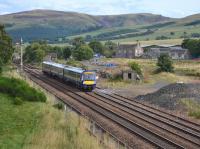 170427 passes the former Blackford station and goods yard on 23rd August 2017. There is little evidence of the planned Highland Spring terminal yet.<br>
<br><br>[Bill Roberton 23/08/2017]