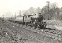 Parkhead V3 67679 photographed near Bowling on 12 April 1958 with a Balloch - Milngavie train.  <br><br>[G H Robin collection by courtesy of the Mitchell Library, Glasgow 12/04/1958]