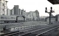 Looking north east across the approach lines at St Enoch on 31 March 1954 as Kingmoor Jubilee 45713 <I<Renown</I> reverses a train of empty stock from Saltmarket Junction into platform 1.<br><br>[G H Robin collection by courtesy of the Mitchell Library, Glasgow 31/03/1954]