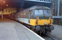 Before the re-opening of stations on the Maryhill line platform 1 at Queen Street saw all sorts of uses. Here it is in use in 1989 to stable a 37 and 47.<br><br>[Ewan Crawford /01/1989]