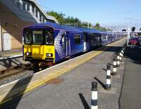 Saturday morning at Motherwell Platform 3. This six-car 318 has come from<br>
Dalmuir via Whifflet and will return to Dalmuir via Blantyre. These service<br>
patterns take some getting used to.<br>
<br><br>[David Panton 02/09/2017]